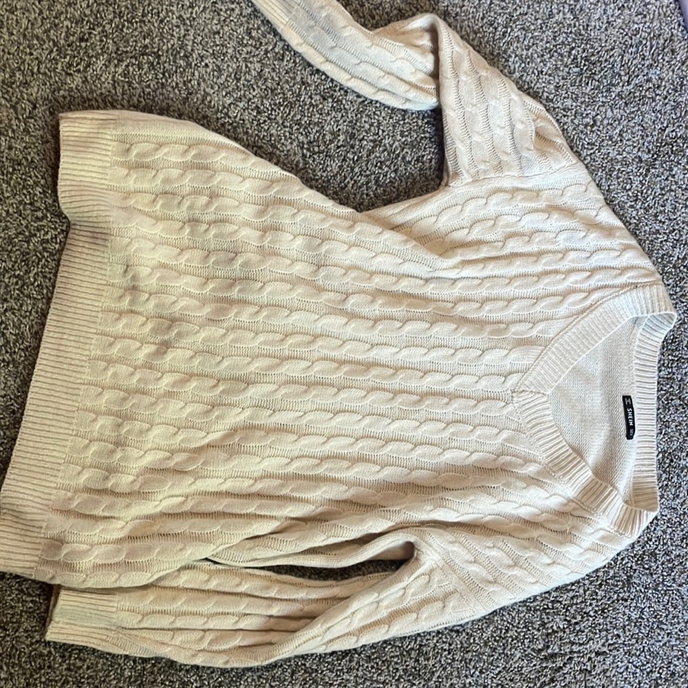 Cream color off the shoulder dress.